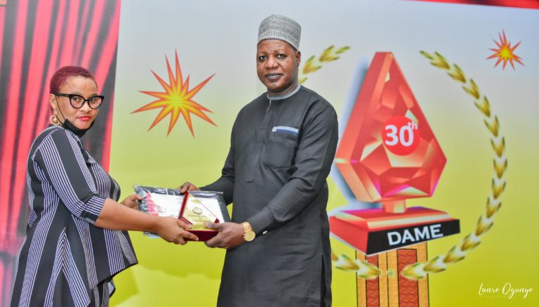 Child-friendly-Reporting-Juliana-Francis-receiving-her-prize-from-Mustapha-Isah-DSC_9995-32-1